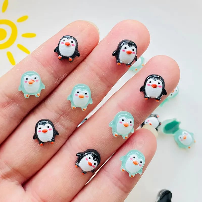 small plastic penguin figurines